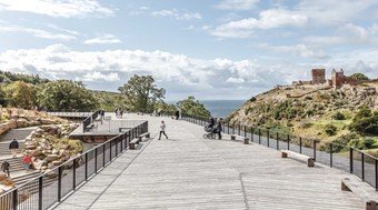 Terrace near the water with people walking - visualisation from Arkitema