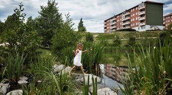 A girl running through a pond system